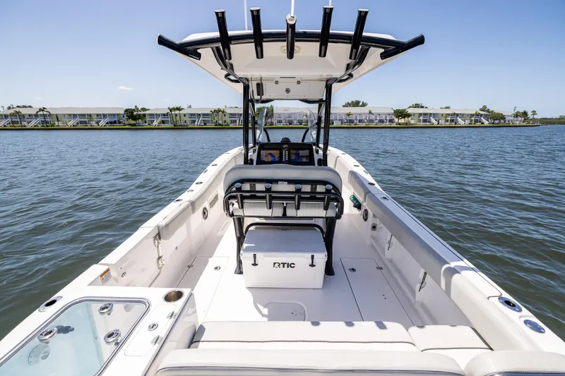 Slide: The Image of 2022 Sea Fox 268 Commander boat on calm water, featuring spacious deck and modern design. - 31