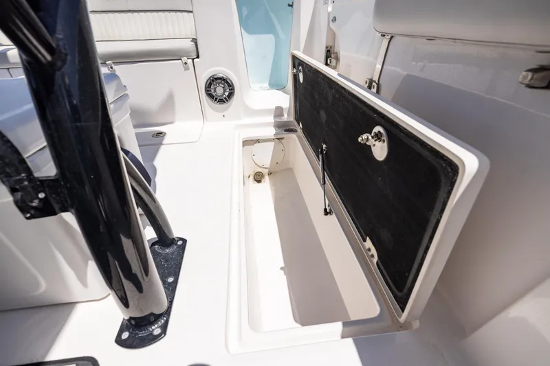 Slide: The Image of 2022 Sea Fox 268 Commander boat storage compartment with open hatch and seating area. - 33