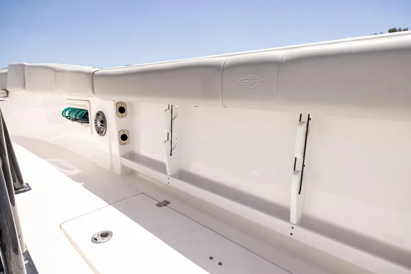 Slide: The Image of 2022 Sea Fox 268 Commander boat interior with rod holders and storage compartments. - 37