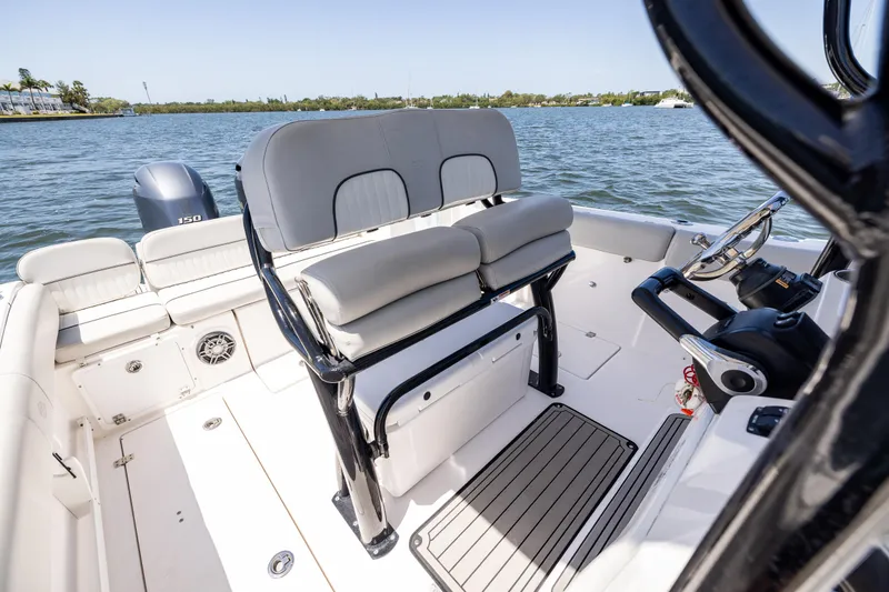 Slide: The Image of 2022 Sea Fox 268 Commander boat interior with seating and steering console on the water. - 39