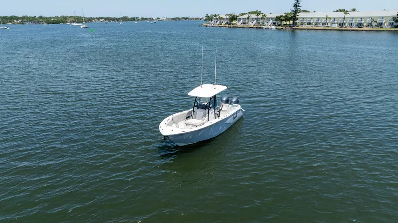 Slide: The Image of 2022 Sea Fox 268 Commander boat on calm water near shoreline. - 4