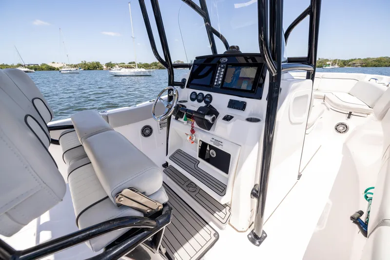 Slide: The Image of 2022 Sea Fox 268 Commander boat interior with helm, seating, and water view. - 41