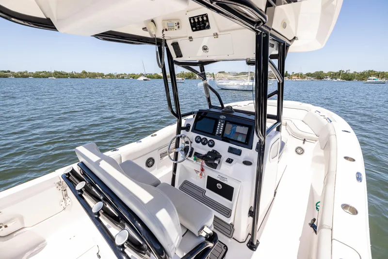 Slide: The Image of 2022 Sea Fox 268 Commander boat interior with modern controls on a sunny day. - 42