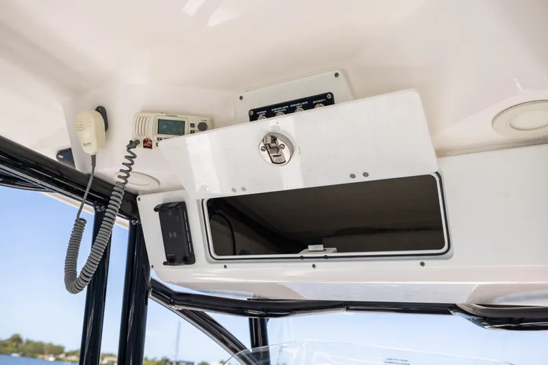 Slide: The Image of 2022 Sea Fox 268 Commander console with storage compartment and marine electronics. - 44