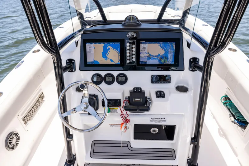 Slide: The Image of 2022 Sea Fox 268 Commander dashboard with dual navigation screens and steering wheel. - 46