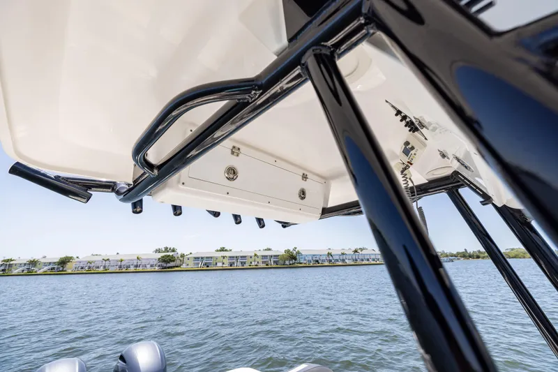 Slide: The Image of 2022 Sea Fox 268 Commander boat, view of T-top and water backdrop. - 49