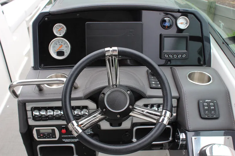 Slide: The Image of Steering console of a 2021 Formula 290 Bowrider with gauges and controls. - 14