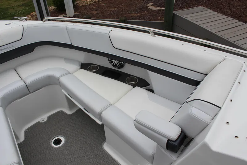 Slide: The Image of 2021 Formula 290 Bowrider interior with white seating and cup holders. - 16