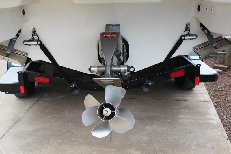 Slide: The Image of 2021 Formula 290 Bowrider boat stern with propeller and trailer. - 4