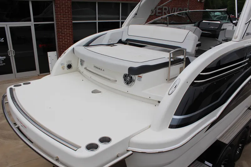 Slide: The Image of 2021 Formula 290 Bowrider boat with spacious deck and sleek design. - 7