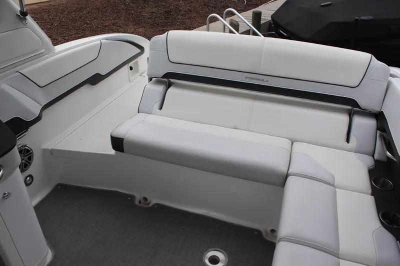 Slide: The Image of 2021 Formula 290 Bowrider interior with white seating and sleek design. - 8