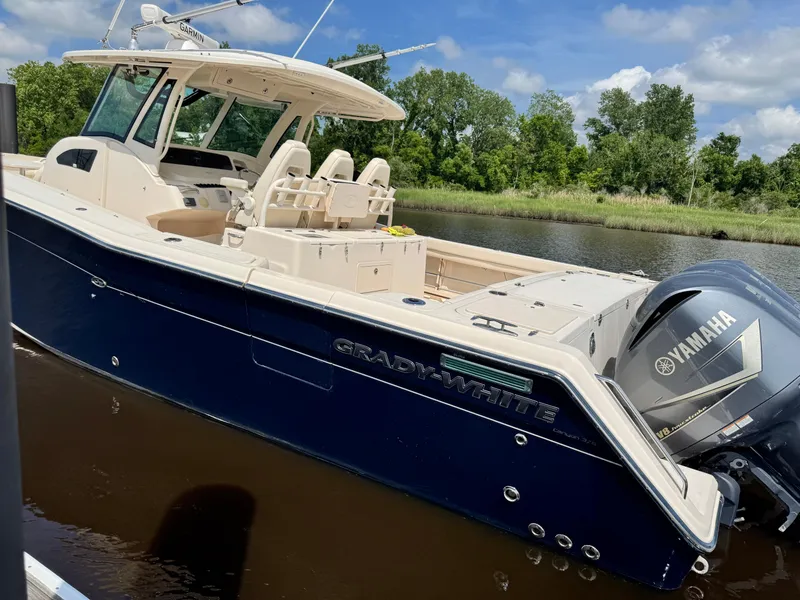 Slide: The Image of 2017 Grady-White Canyon 376 boat with Yamaha engine on a calm river. - 4