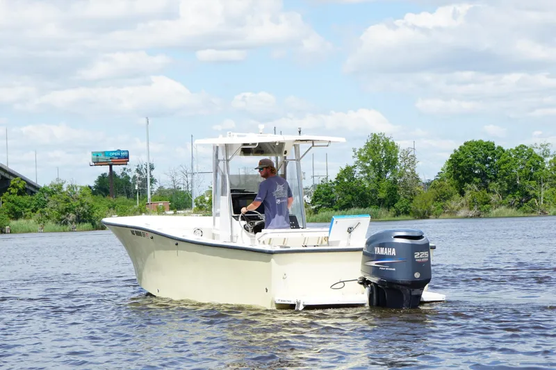 Slide: The Image of 1993 KenCraft CHALLENGER 250CC boat on water with Yamaha outboard motor. - 4