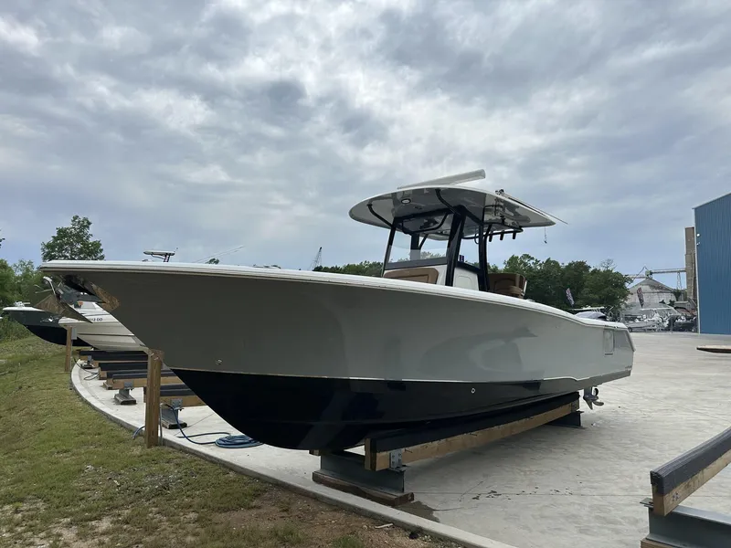 Slide: The Image of 2020 Sea Hunt Gamefish 30 with Coffin Box on display outdoors. - 12