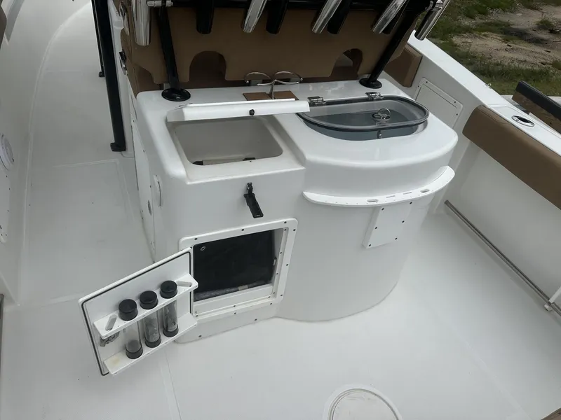 Slide: The Image of 2020 Sea Hunt Gamefish 30 boat interior with storage and utility features. - 17