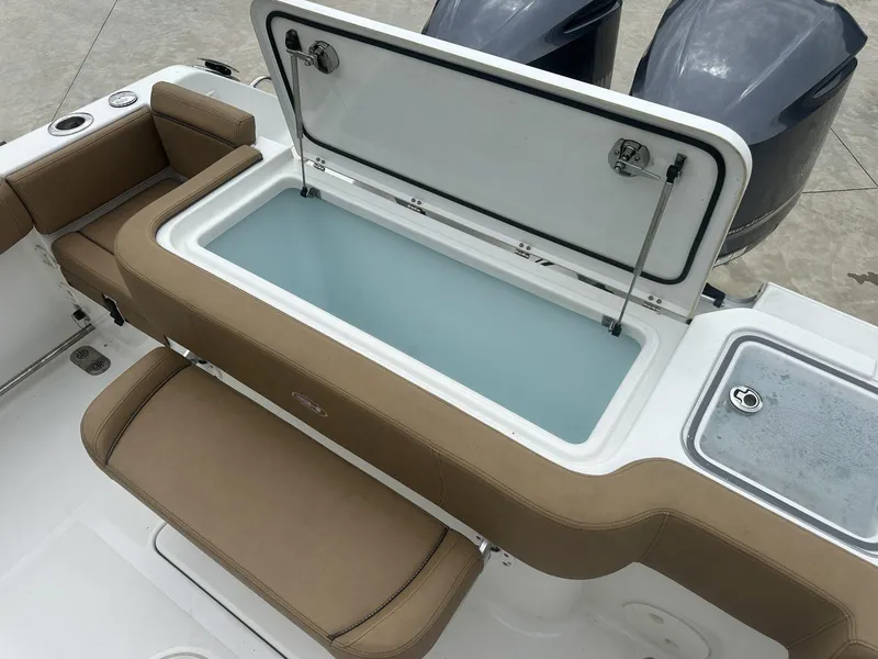 Slide: The Image of 2020 Sea Hunt Gamefish 30 with Coffin Box, featuring dual engines and cushioned seating. - 21