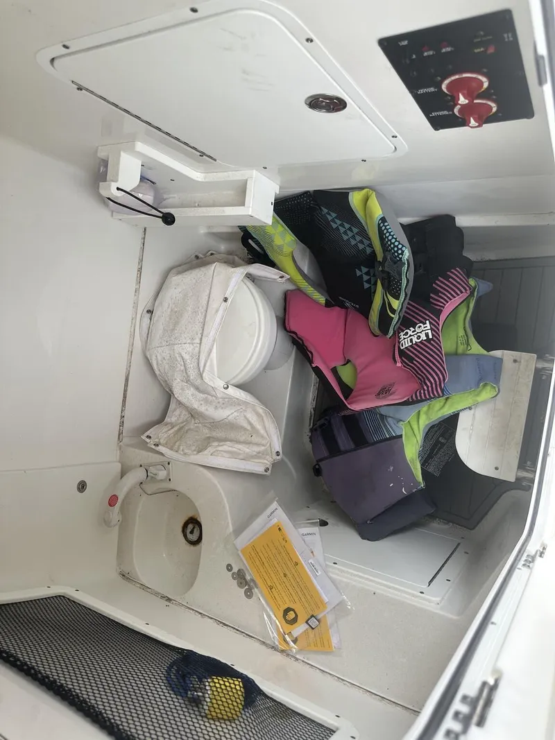 Slide: The Image of Interior of 2020 Sea Hunt Gamefish 30 boat with life jackets and storage. - 28