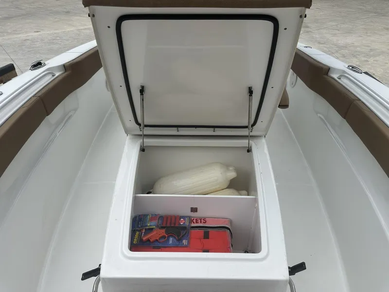 Slide: The Image of 2020 Sea Hunt Gamefish 30 with Coffin Box, open storage compartment with safety gear. - 34