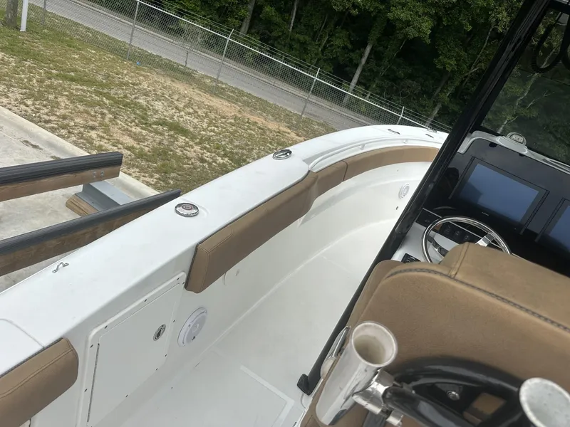 Slide: The Image of 2020 Sea Hunt Gamefish 30 boat interior with steering console and seating. - 38