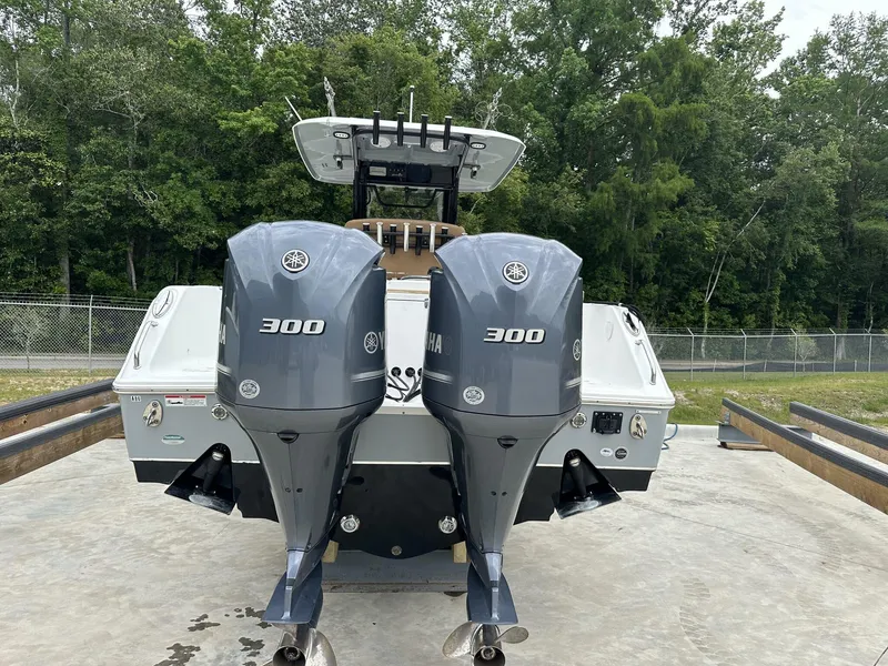 Slide: The Image of 2020 Sea Hunt Gamefish 30 with twin Yamaha 300 engines, parked outdoors. - 5