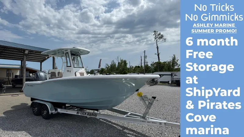 Slide: The Image of 2025 Tidewater 232 CC Adventure boat on trailer, Ashley Marine summer promo, free storage offer. - 1