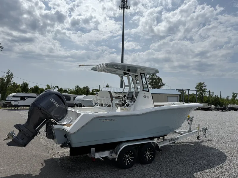 Slide: The Image of 2025 Tidewater 232 CC Adventure boat with Seakeeper Ride on trailer, outdoors. - 3