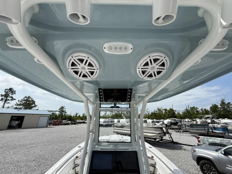 Slide: The Image of 2025 Tidewater 232 CC Adventure boat interior with speakers and control panel. - 7