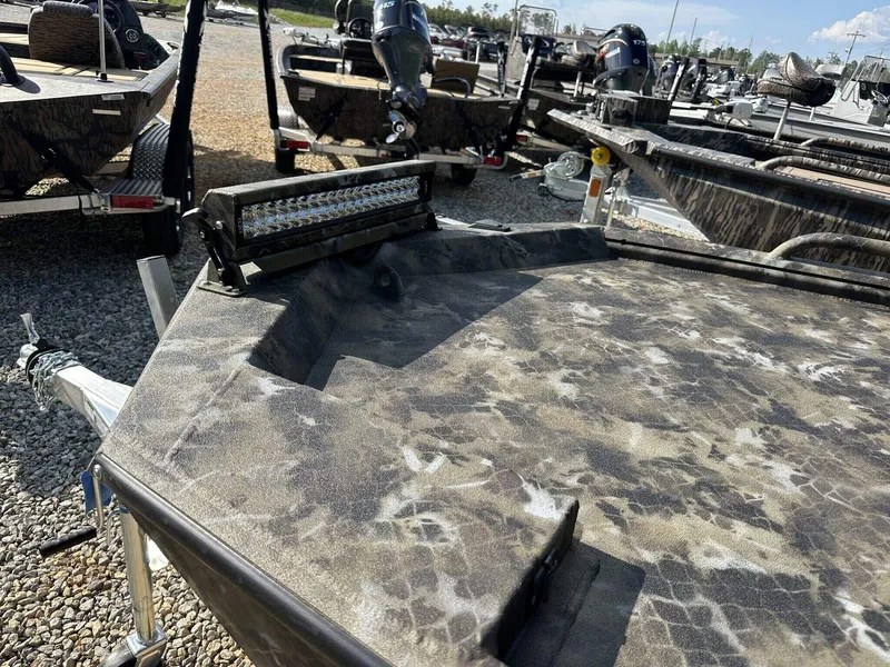 Slide: The Image of 2025 Excel Viper F4 1751 boat with camouflage pattern and mounted LED light bar. - 14