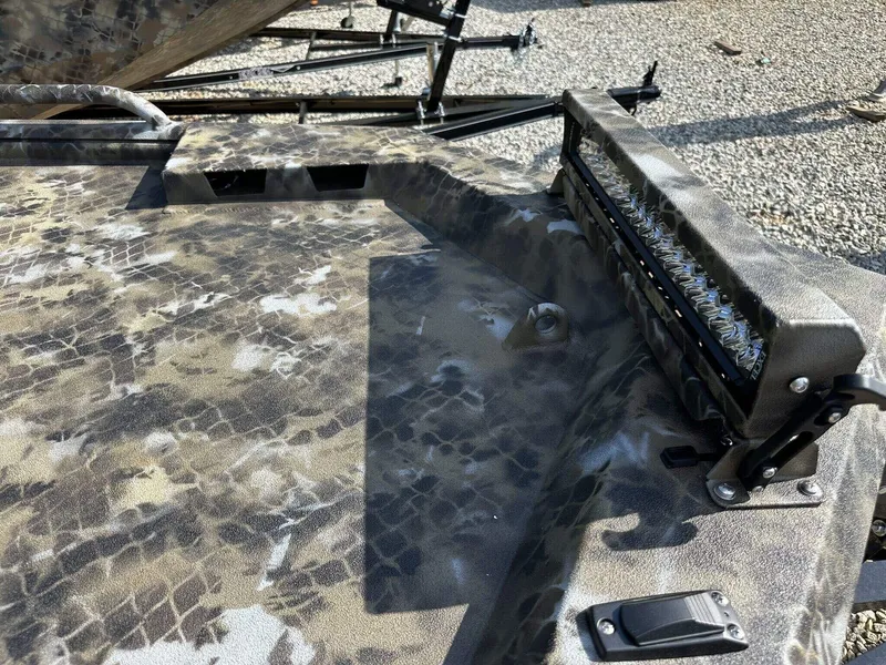 Slide: The Image of Camouflage-patterned deck of 2025 Excel Viper F4 1751 boat with mounted light bar. - 3