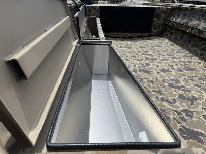 Slide: The Image of 2025 Excel Viper F4 1751-YAMHA 60 boat interior with camouflage design and storage compartment. - 4