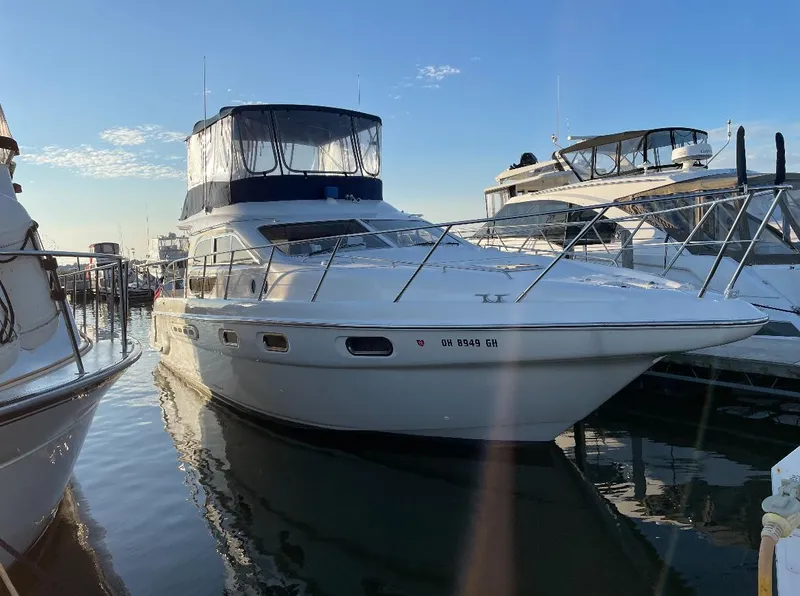 Slide: The Image of 2000 Sealine F44 yacht docked at marina under clear blue sky. - 1