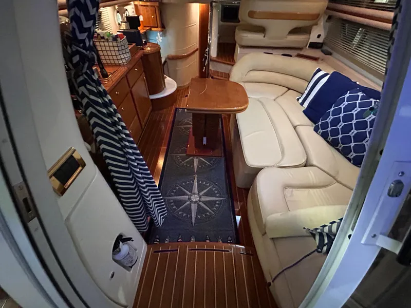 Slide: The Image of Luxurious interior of a 2000 Sealine F44 yacht with elegant seating and wooden finishes. - 10