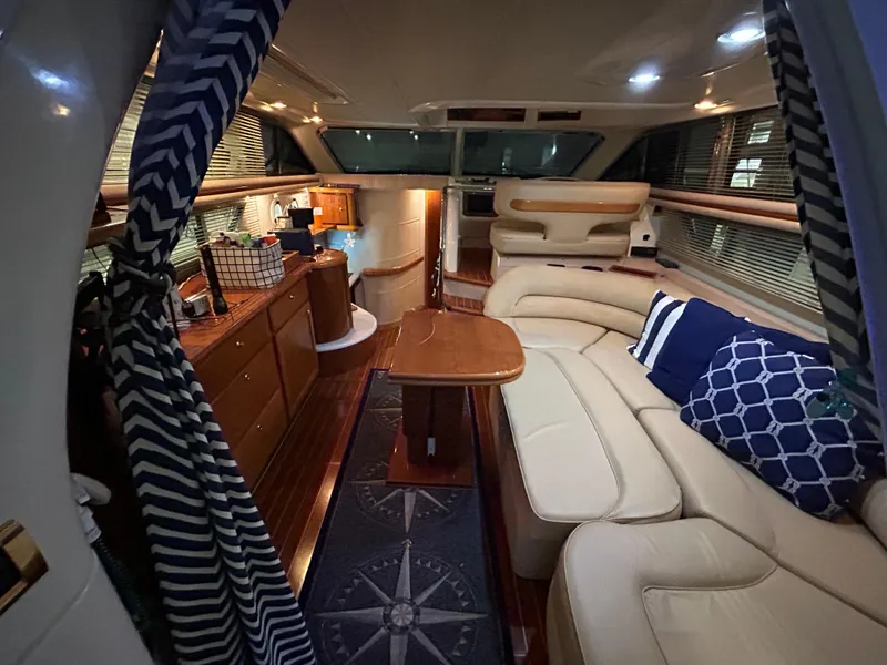 Slide: The Image of Luxurious interior of a 2000 Sealine F44 yacht with elegant seating and nautical decor. - 11