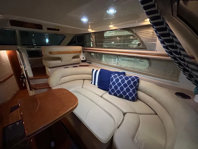 Slide: The Image of Luxurious interior of a 2000 Sealine F44 yacht with elegant seating and cushions. - 12