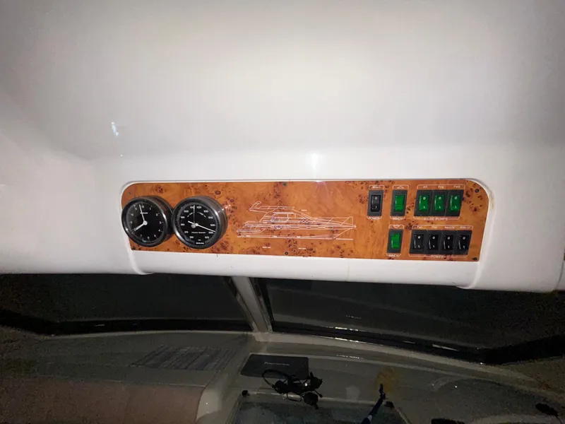 Slide: The Image of Control panel of a 2000 Sealine F44 yacht with gauges and switches. - 21