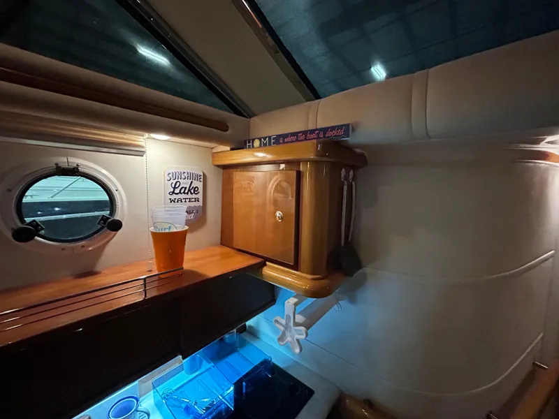 Slide: The Image of Interior of 2000 Sealine F44 yacht with wooden cabinetry and nautical decor. - 27