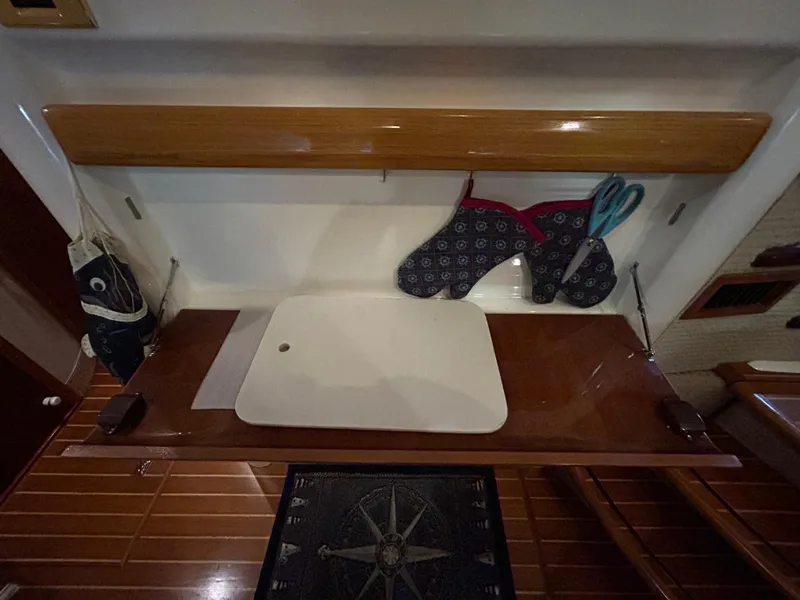 Slide: The Image of Interior of 2000 Sealine F44 yacht with wooden countertop and kitchen accessories. - 28