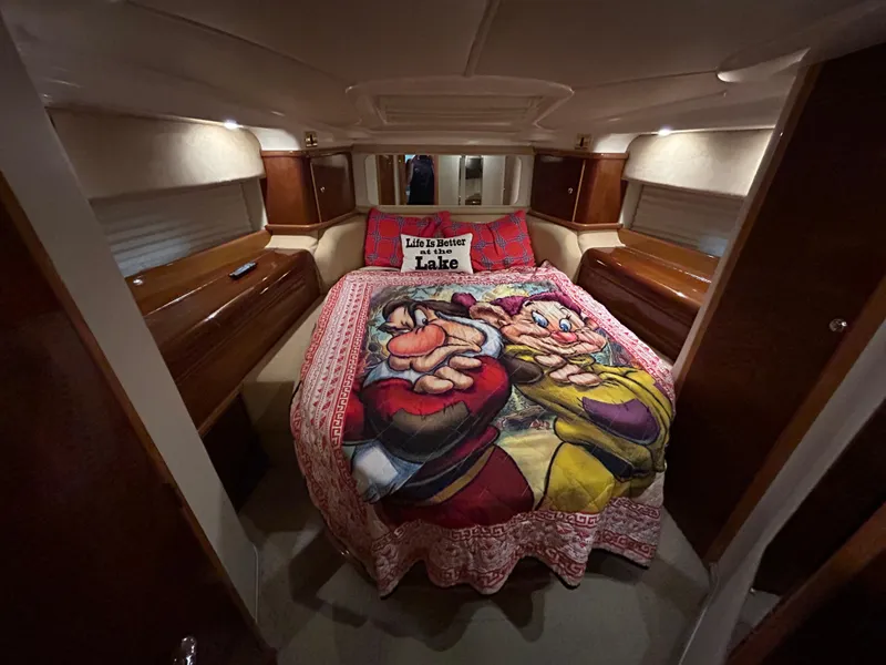 Slide: The Image of Cozy bedroom in 2000 Sealine F44 yacht with cartoon-themed bedding. - 34