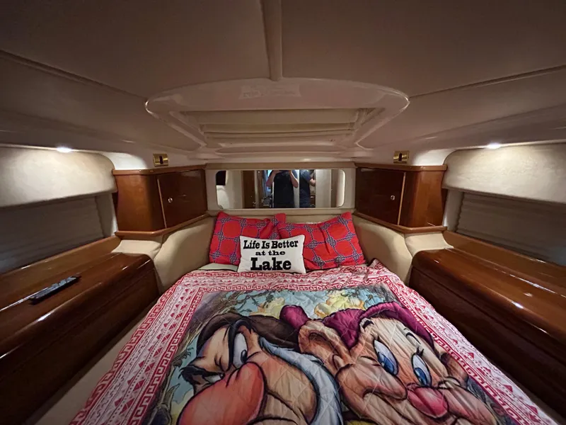 Slide: The Image of Luxurious cabin interior of 2000 Sealine F44 yacht with cozy bedding and decorative pillows. - 35
