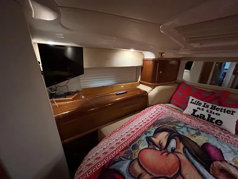 Slide: The Image of Interior of 2000 Sealine F44 yacht with cozy bedroom and TV setup. - 37