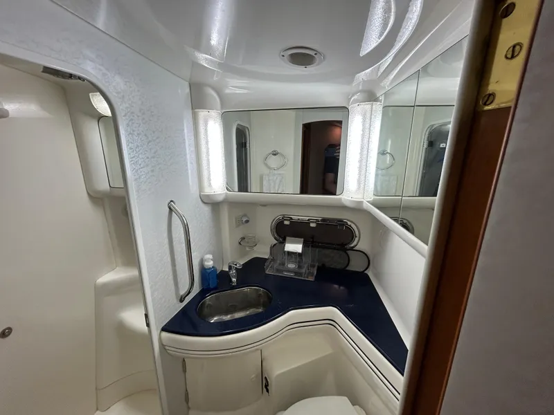 Slide: The Image of Luxurious bathroom in 2000 Sealine F44 yacht with modern fixtures and elegant design. - 39