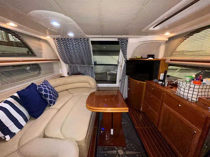 Slide: The Image of Luxurious interior of 2000 Sealine F44 yacht with cozy seating and modern amenities. - 42