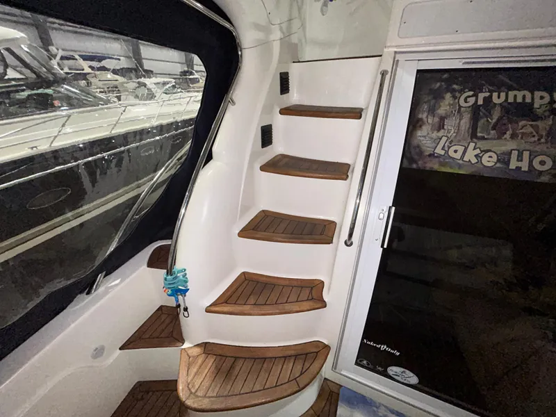 Slide: The Image of Interior stairs of a 2000 Sealine F44 yacht with wooden steps. - 43