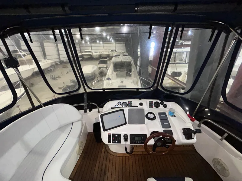 Slide: The Image of Interior view of 2000 Sealine F44 yacht cockpit with navigation equipment. - 46