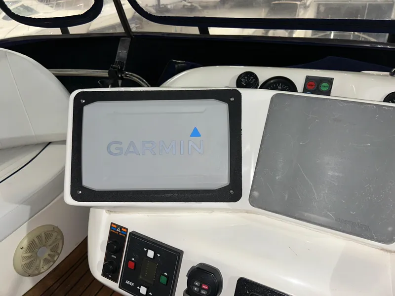 Slide: The Image of Control panel of a 2000 Sealine F44 yacht with Garmin navigation system. - 48