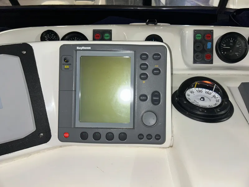 Slide: The Image of Control panel of a 2000 Sealine F44 boat with navigation equipment. - 49