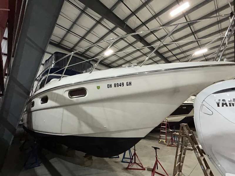 Slide: The Image of 2000 Sealine F44 yacht in storage, side view, indoors. - 6