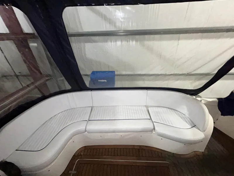 Slide: The Image of Sealine F44 2000 yacht interior with white seating and wooden flooring. - 9