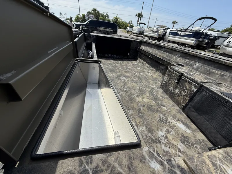 Slide: The Image of 2025 Excel Viper F4 boat interior with camouflage design and storage compartments. - 5