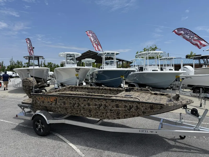 Slide: The Image of 2025 Excel Viper F4 1751-YAMHA 60 boat on trailer, displayed outdoors with flags. - 1